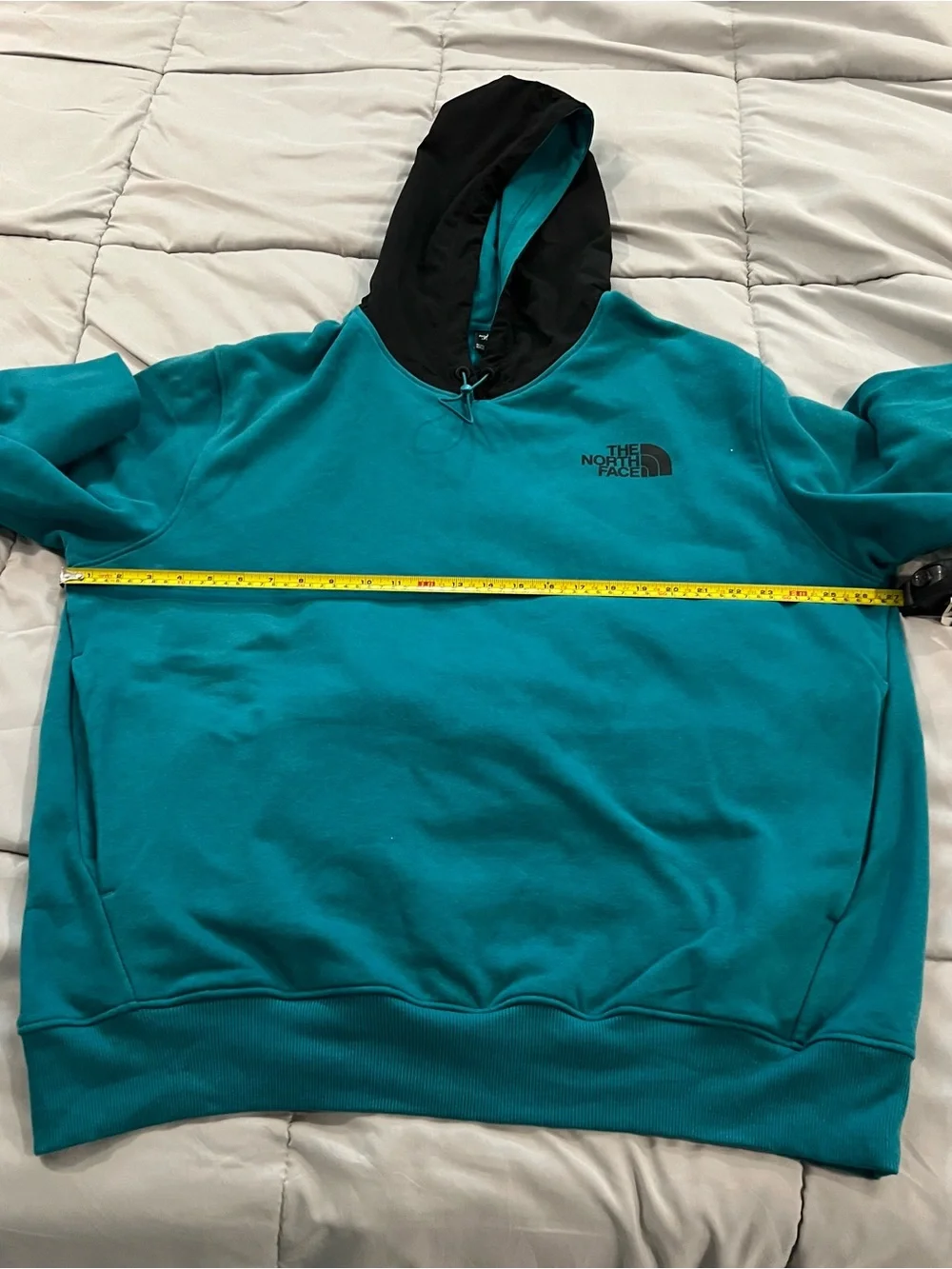 The North Face  Me's Teal Hoodie pullover with Black Hood snd pockets size XL.